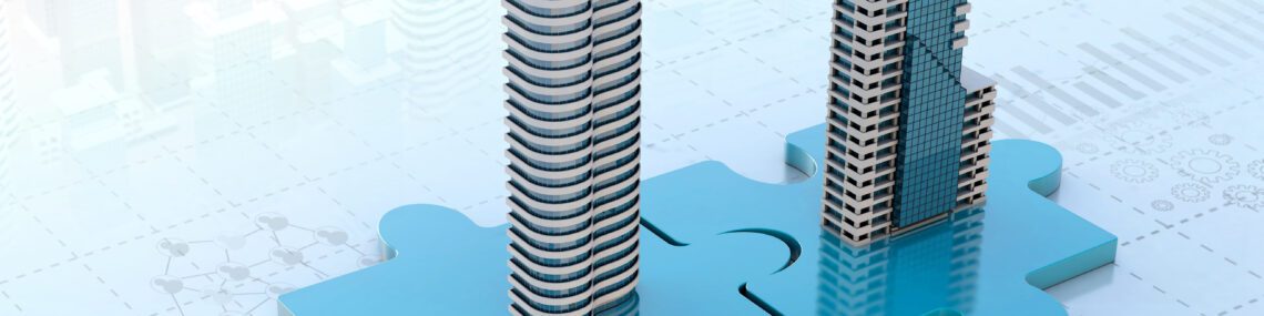 Two company towers on interlocking puzzle pieces illustrating a merger of two businesses