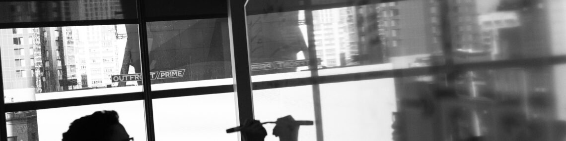 Black and white photo of founder writing business plans on whiteboard