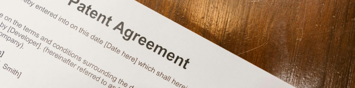 Patent agreement paperwork on desk