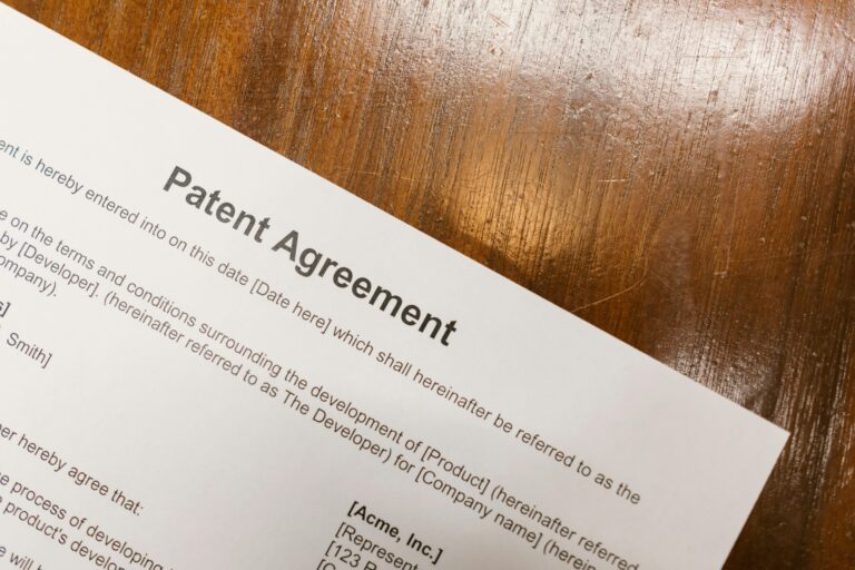 Patent agreement paperwork on desk