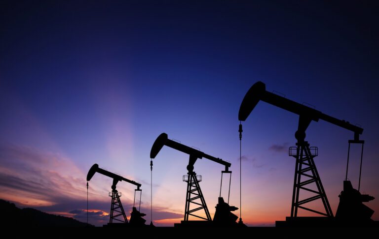 Oil pump oil rig energy industrial machine for petroleum in the sunset background for design