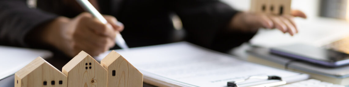 Real estate contract signing concept. Businesswoman signing a contract to legally for the purchase, mortgage and rental of real estate.