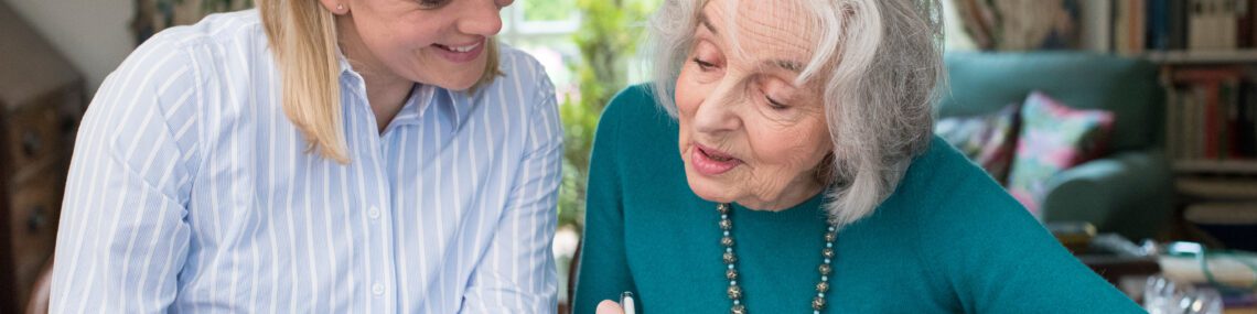 Attorney Helping Senior With Power of Attorney Paperwork