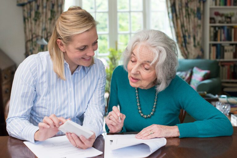 Attorney Helping Senior With Power of Attorney Paperwork