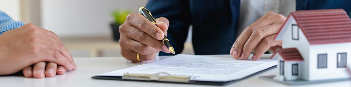 Estate attorney and clients are signing contracts and discussing small estate planning in Oklahoma