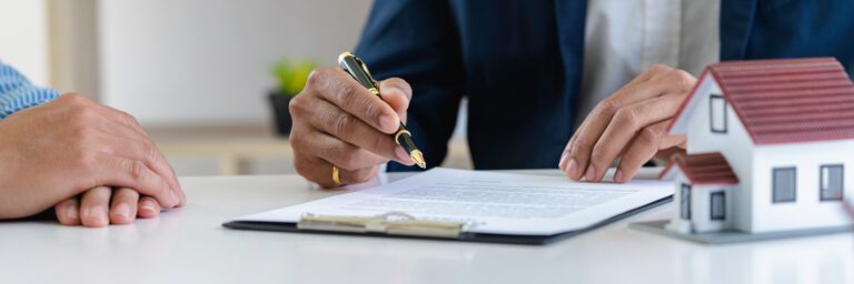 Estate attorney and clients are signing contracts and discussing small estate planning in Oklahoma