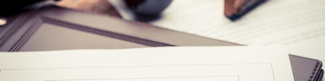 Last Will and testament document on wooden table close up