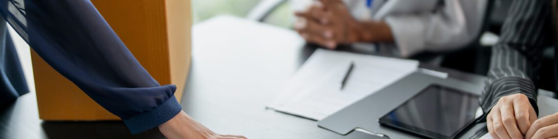 Business partner resigning from company ownership turning in resignation letter to partners