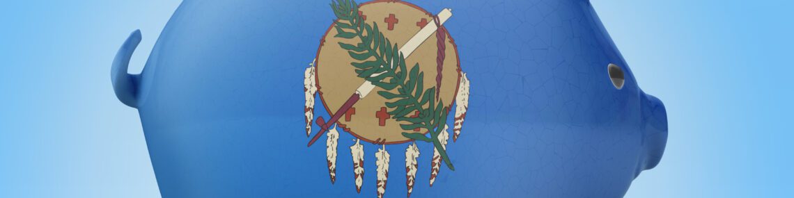 Side view of a piggy bank with the flag design of Oklahoma