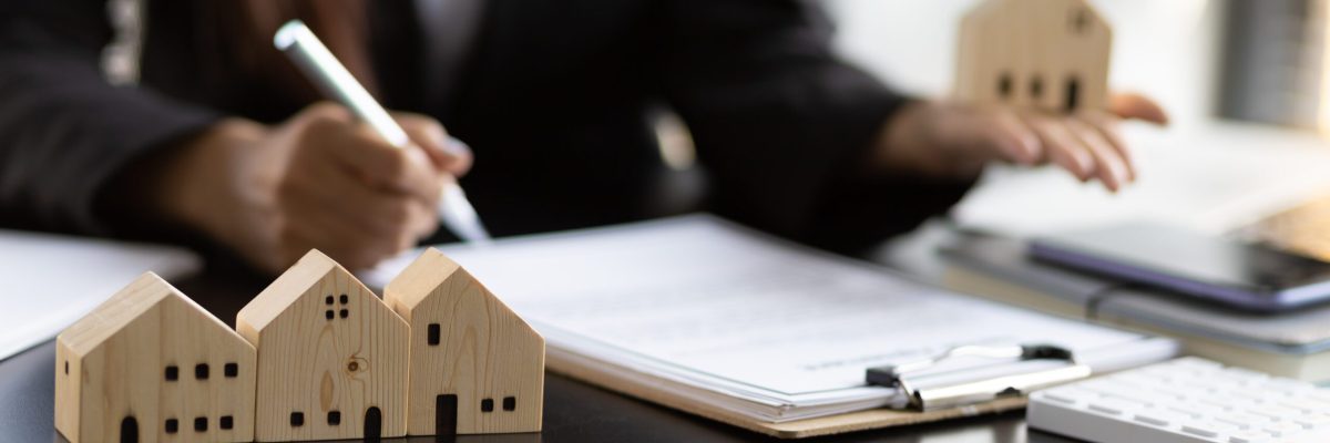 Real estate contract signing concept. Businesswoman signing a contract to legally for the purchase, mortgage and rental of real estate.