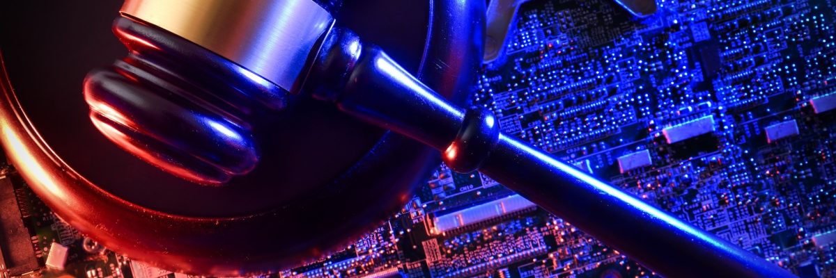 A judge’s gavel resting on a glowing circuit board, symbolizing the intersection of law, justice, and advanced digital technology in modern legal systems.