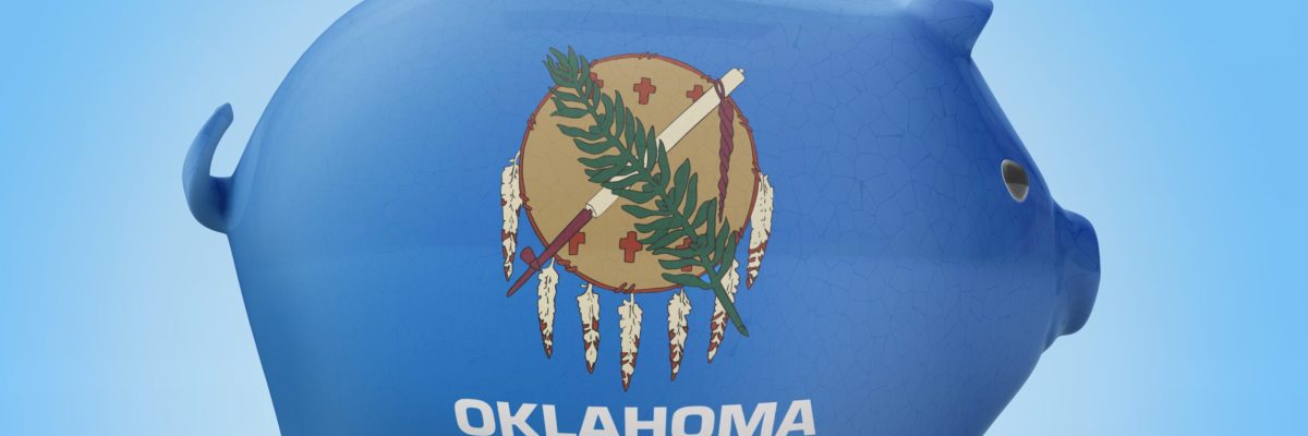 Side view of a piggy bank with the flag design of Oklahoma