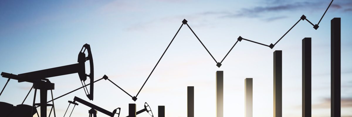 Silhouetted oil pumpjacks at sunset beside a rising bar and line chart, illustrating oil price volatility