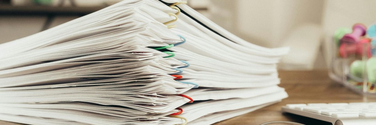 pexels-kindelmedia-7054757 A Close-Up Shot of Paper Clipped Documents