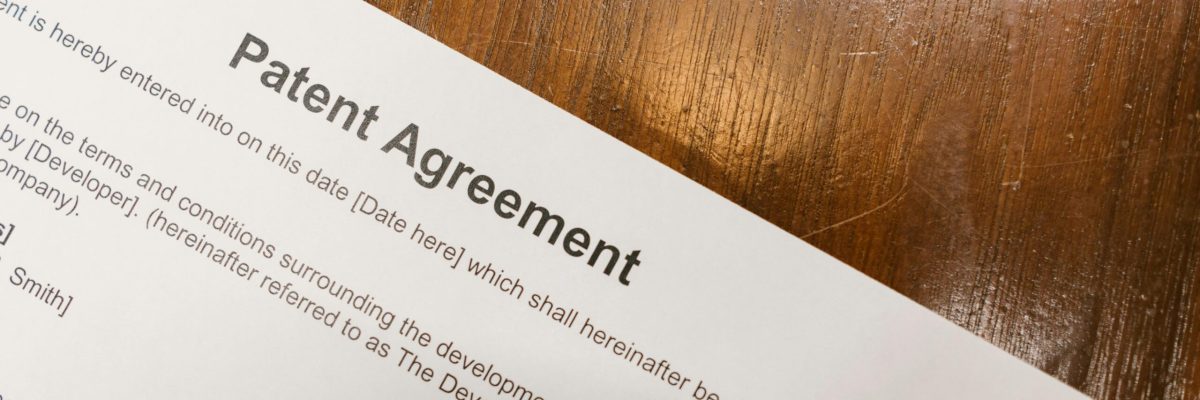 Patent agreement paperwork on desk