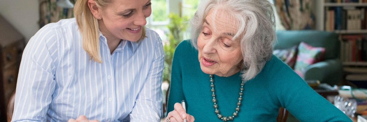 Attorney Helping Senior With Power of Attorney Paperwork